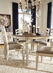 Realyn Chipped White Oval Dining Room Set - Luna Furniture