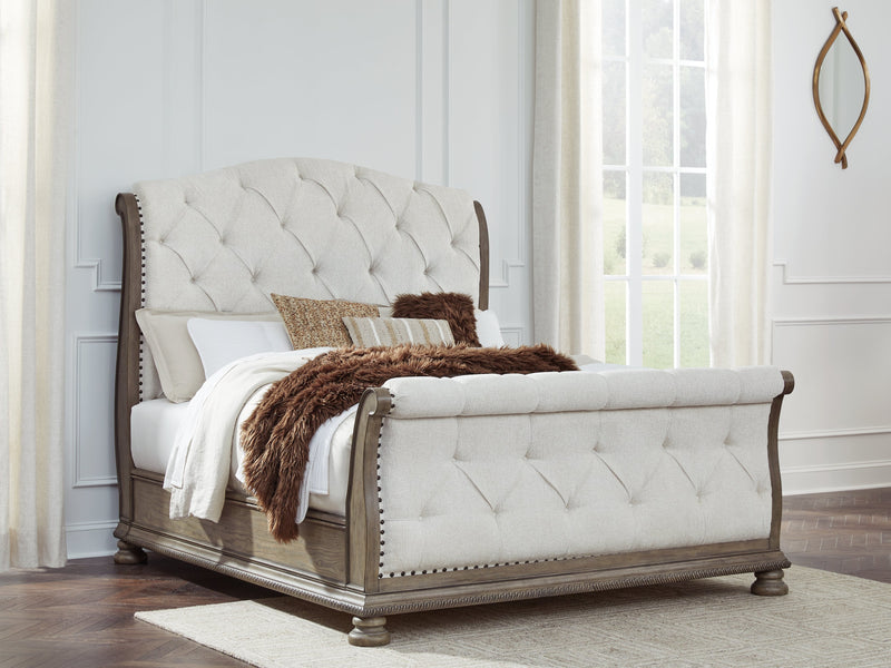 Ardenfield Queen Upholstered Sleigh Bed with Mirrored Dresser and Chest in Light Brown from Ashley - Luna Furniture