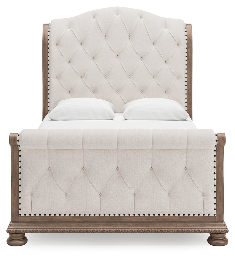 Ardenfield Queen Upholstered Sleigh Bed with Mirrored Dresser and Chest in Light Brown from Ashley - Luna Furniture