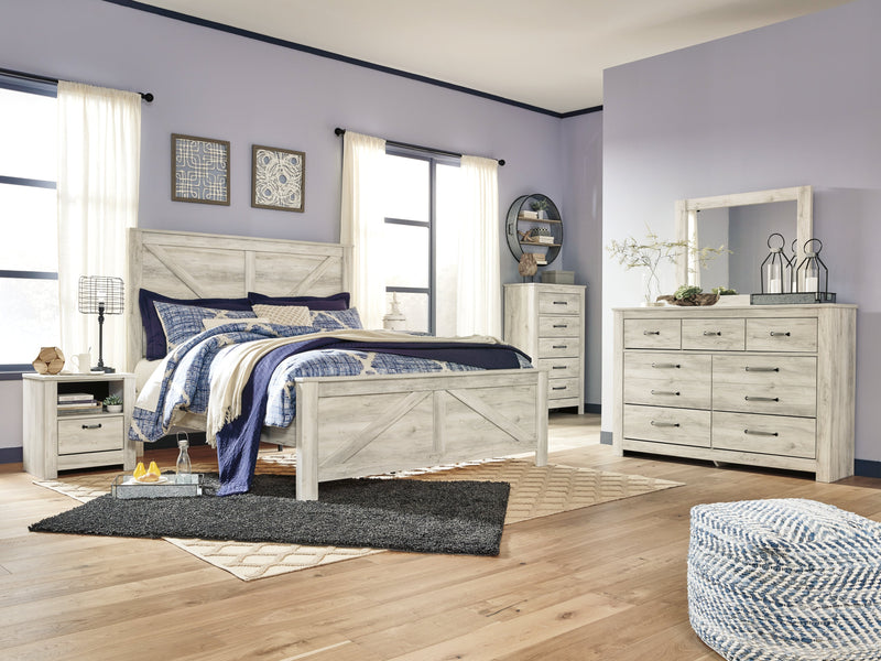 Bellaby King Crossbuck Panel Bed with Mirrored Dresser, Chest and Nightstand in Whitewash - PKG004704
