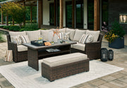 Brook Ranch Outdoor Sectional Set with Coffee Table in Brown from Ashley - Luna Furniture
