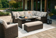 Brook Ranch Outdoor Sectional Set with Lounge Chair and Coffee Table in Brown from Ashley - Luna Furniture