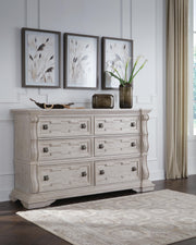 Bruchandi King Upholstered Panel Bed with Dresser and Nightstand in Antique White - PKG023748