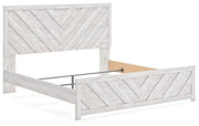 Cayboni King Panel Bed with Mirrored Dresser in Whitewash - PKG019173