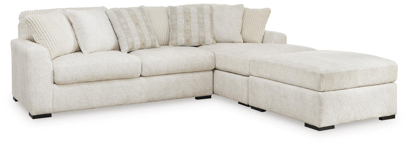 Chessington 2-Piece Sectional with Ottoman in Ivory - PKG018571