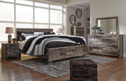 Derekson King Panel Bed with Mirrored Dresser, Chest and Nightstand in Multi Gray - PKG003482