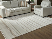 Gadence Ivory/Tan 7'8" x 10' Area Rug - R407641
