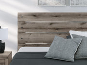 Graystorm King Panel Bed, Dresser and Mirror in Brown Gray - PKG021355