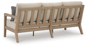 Hallow Creek Outdoor Sofa and Loveseat in Driftwood - PKG021263