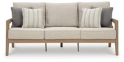 Hallow Creek Outdoor Sofa and Loveseat with Coffee Table in Driftwood - PKG021264