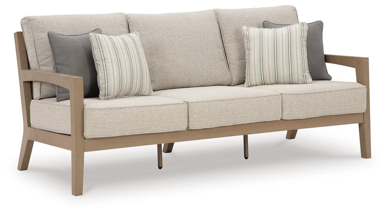 Hallow Creek Outdoor Sofa and Loveseat with Coffee Table in Driftwood - PKG021264