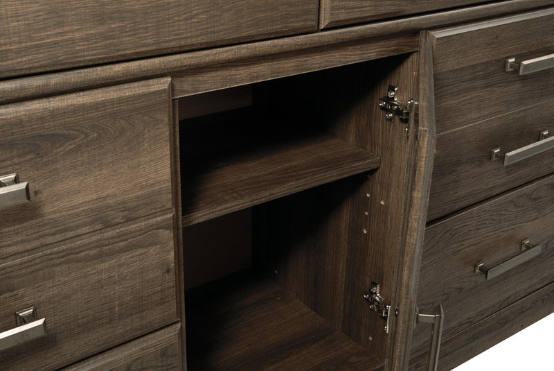 Juararo Dark Brown King Poster Bed, Dresser, Chest and Nightstand - B251B35