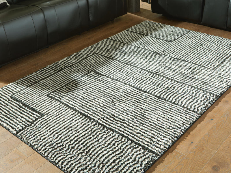 Kurtmen Black/Ivory 5' x 7' Area Rug - R407592