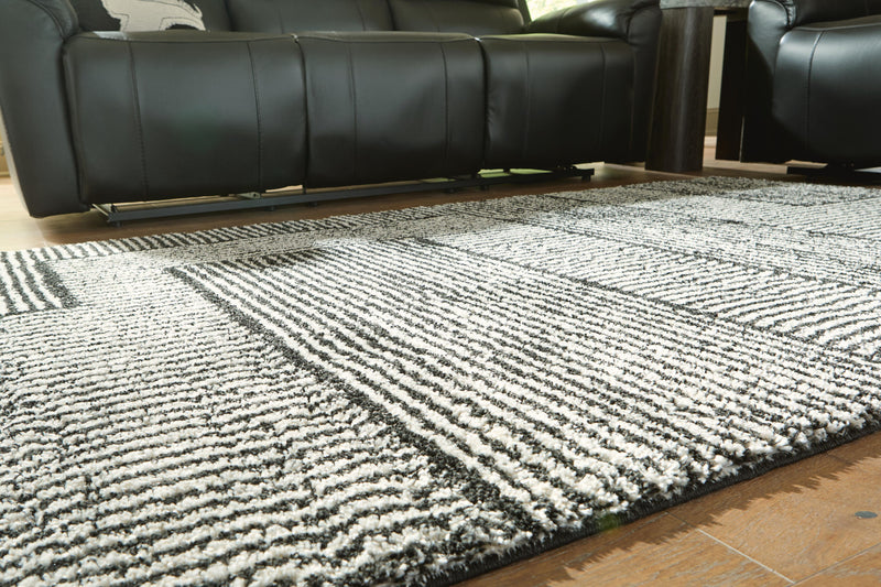 Kurtmen Black/Ivory 5' x 7' Area Rug - R407592