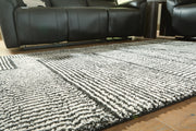 Kurtmen Black/Ivory 7'10" x 9'10" Area Rug - R407591