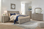 Lettner King Sleigh Bed with 2 Storage Drawers with Mirrored Dresser in Light Gray - PKG006602