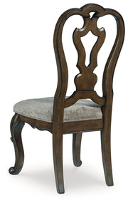 Maylee Dining Table and 8 Chairs with Storage in Dark Brown from Ashley - Luna Furniture