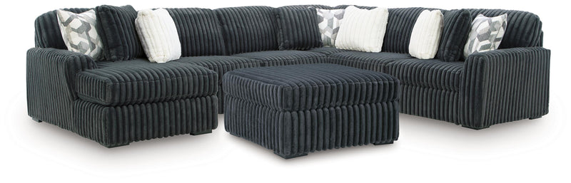 Midnight-Madness 4-Piece Sectional and Ottoman - 98105U5