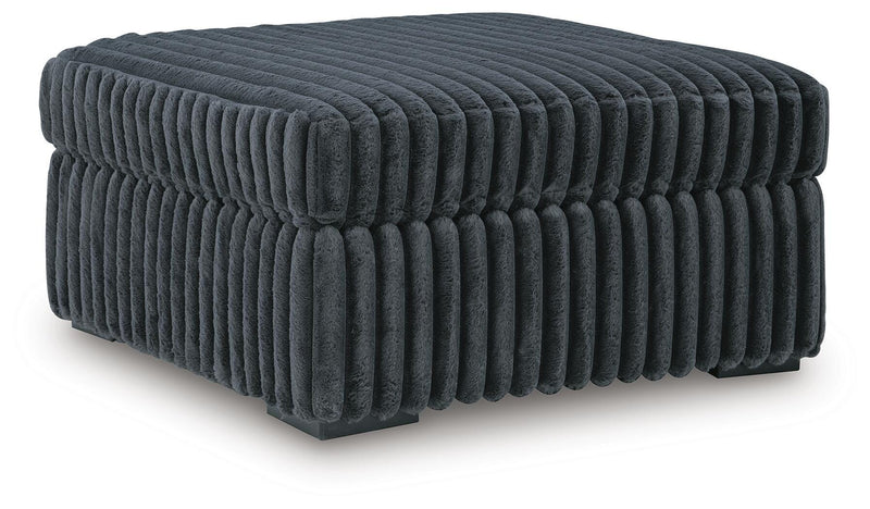 Midnight-Madness 4-Piece Sectional and Ottoman - 98105U5