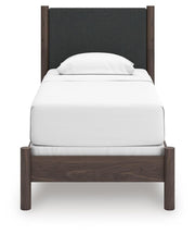 Pamytta Twin Upholstered Panel Bed, Dresser and Chest in Brown - PKG022771