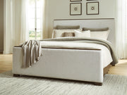 Radkin Burnished Brown California King Upholstered Panel Bed - PCB843B5