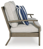 Rainier Ranch Outdoor Sofa and Loveseat with Coffee Table in Brown/Beige from Ashley - Luna Furniture