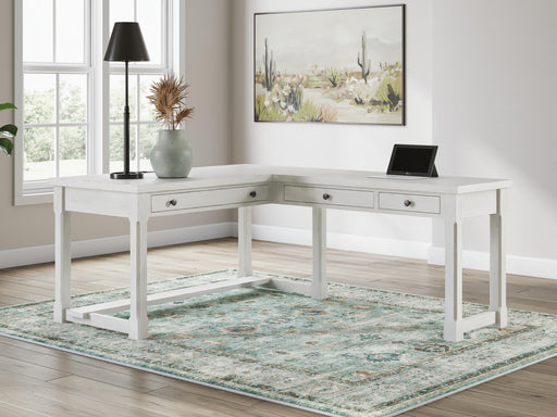 Robbinsdale Antique White L-Shaped Home Office Desk - H742H1