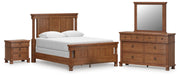 Rowlenstown Queen Poster Bed with Mirrored Dresser and Nightstand in Brown - PKG023757