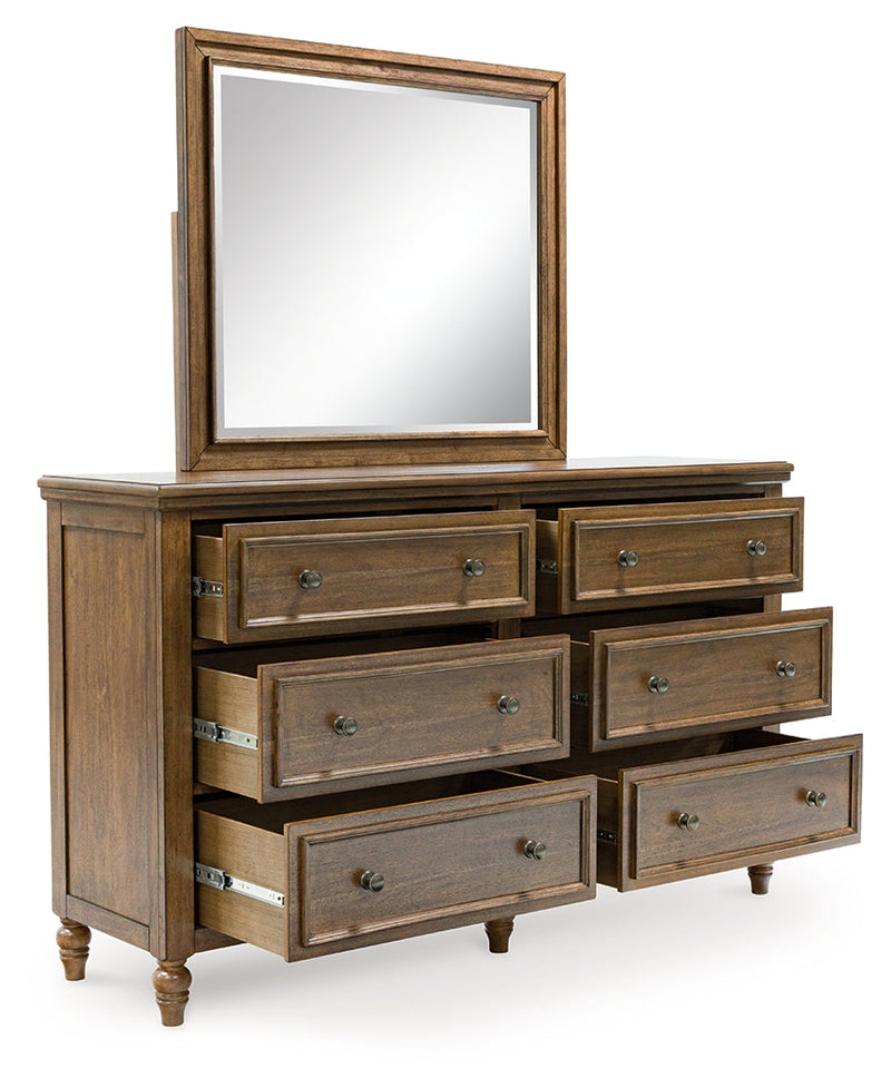 Sturlayne King Upholstered Panel Bed with Mirrored Dresser and Chest in Brown from Ashley - Luna Furniture