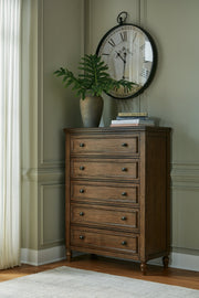 Sturlayne Queen Upholstered Panel Bed with Mirrored Dresser and Chest in Brown from Ashley - Luna Furniture