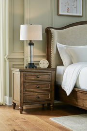 Sturlayne Queen Upholstered Panel Bed with Mirrored Dresser and Nightstand in Brown from Ashley - Luna Furniture