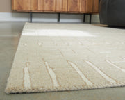 Wolbert Tan/Ivory 5' x 7' Area Rug - R407662
