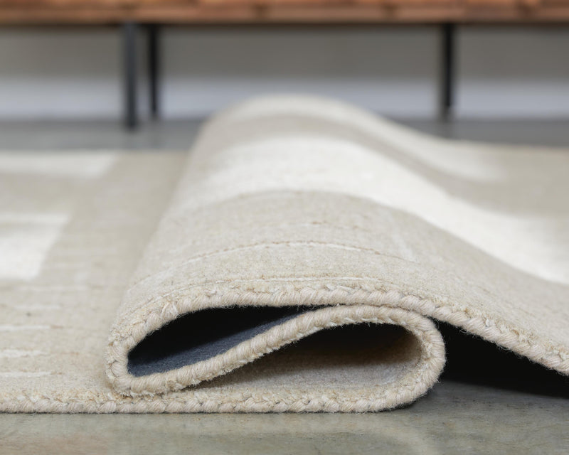 Wolbert Tan/Ivory 5' x 7' Area Rug - R407662