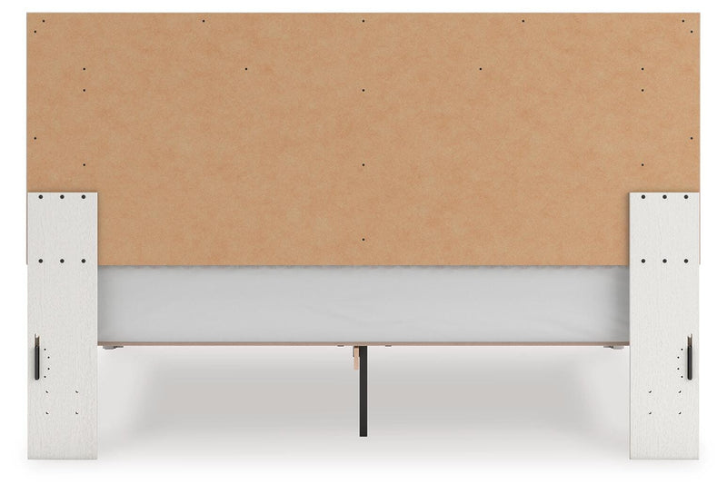 Zuraleus King Upholstered Panel Platform Bed, Chest and  Nightstand in White - PKG022817
